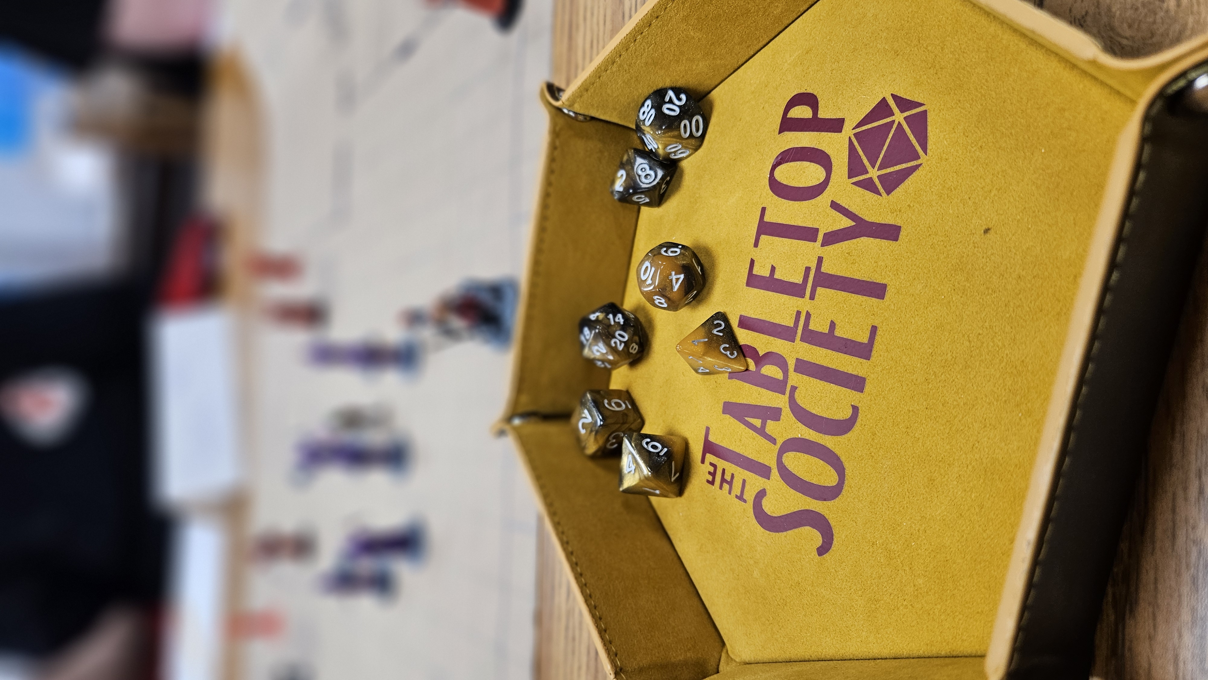 The Tabletop Society community gathering around tabletop games